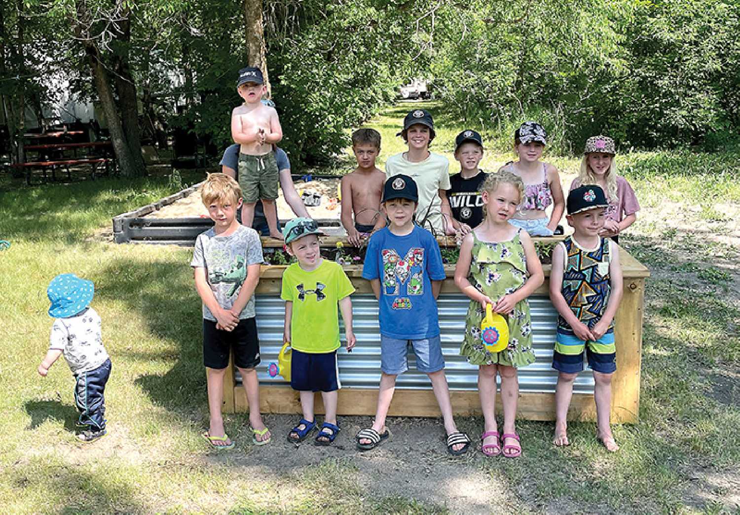 Kids whose families stay at the regional park planted flowers of their own at the newly added flower gardens, and will be responsible for taking care of them throughout summer to help contribute to the parks beautification.